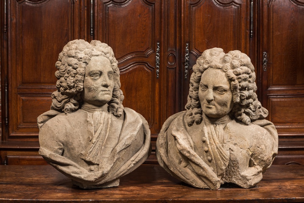 A pair of French stone busts of noblemen, 18th C.