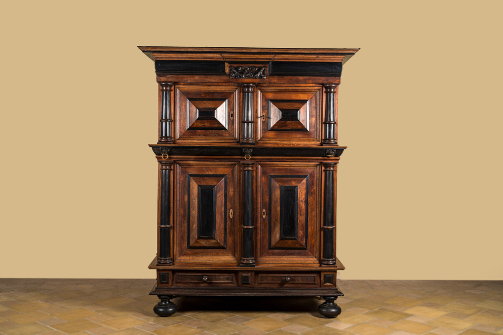 A Dutch partly ebonised wooden four-door cupboard, 17th C.