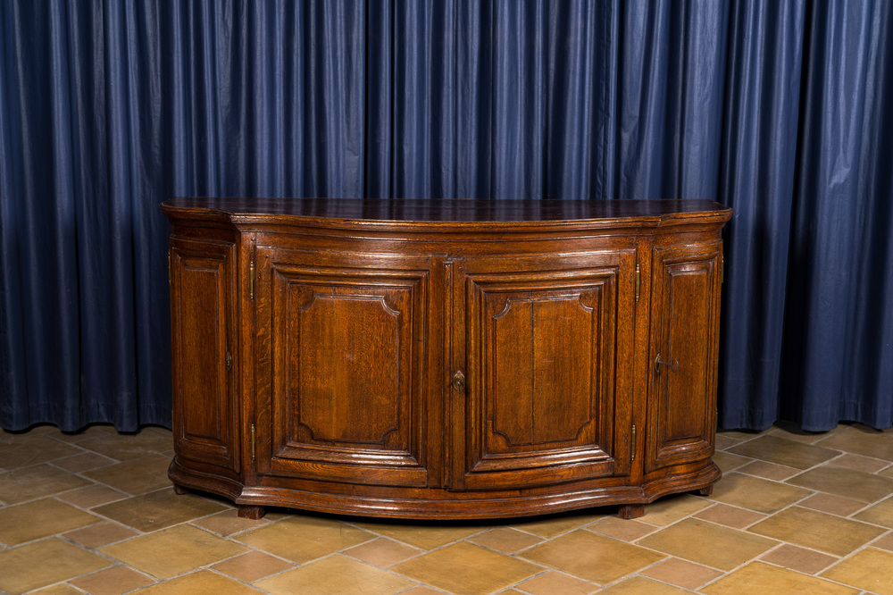 A French oak sideboard with curved front, 18th C.