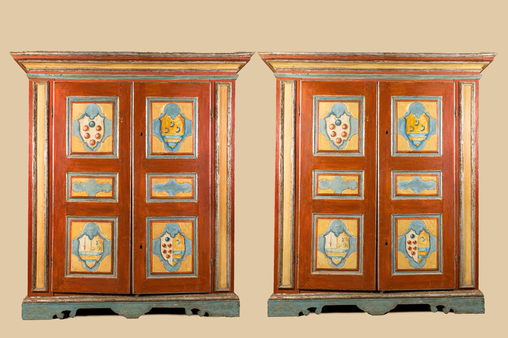 A pair of large Italian polychrome wooden two-door cupboards with coats of arms, 17th C.