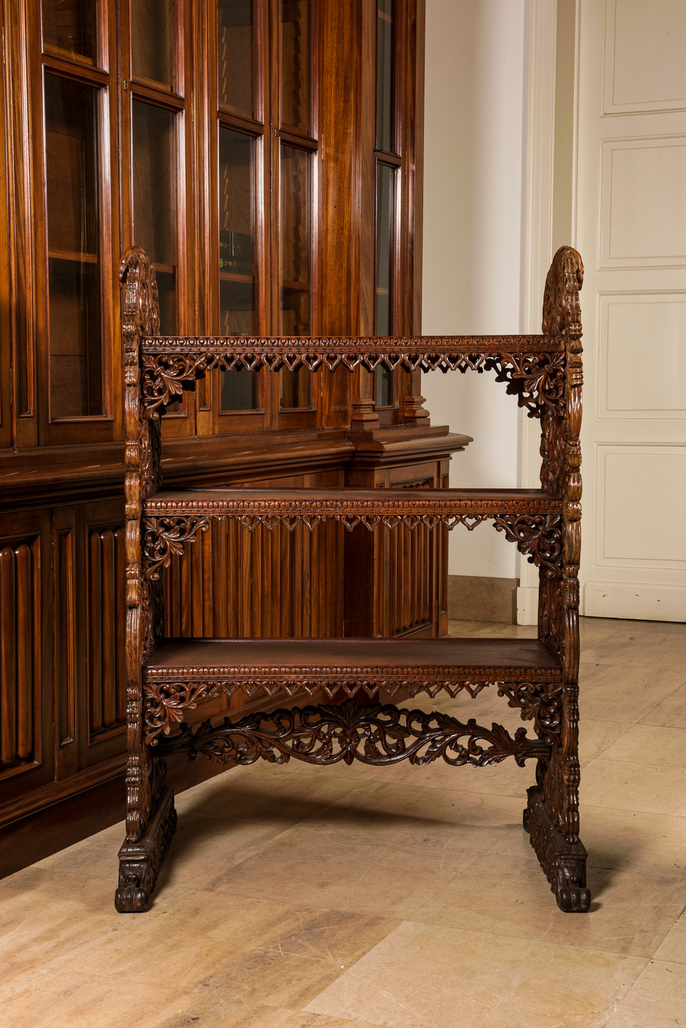 A richly carved oak etag&egrave;re with floral design, probably Italy, 19th C.