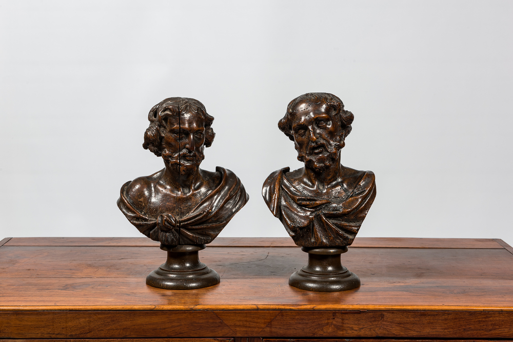 A pair of Flemish wooden busts of evangelists on a base, 17th C.