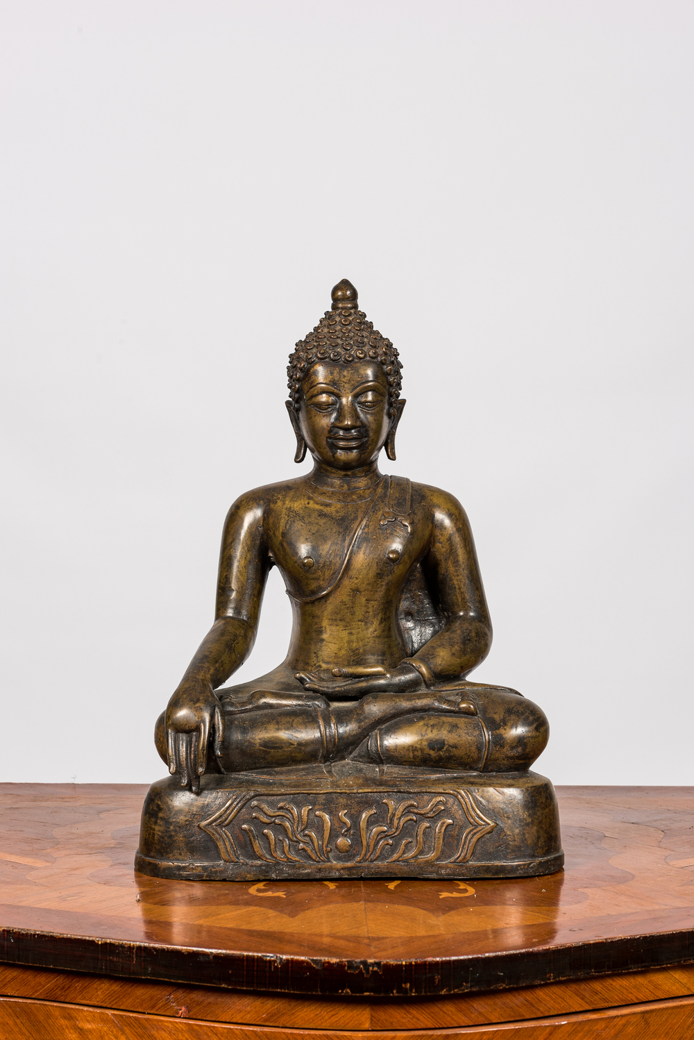 A patinated bronze figure of a seated Buddha, Burma, 19/20th C.