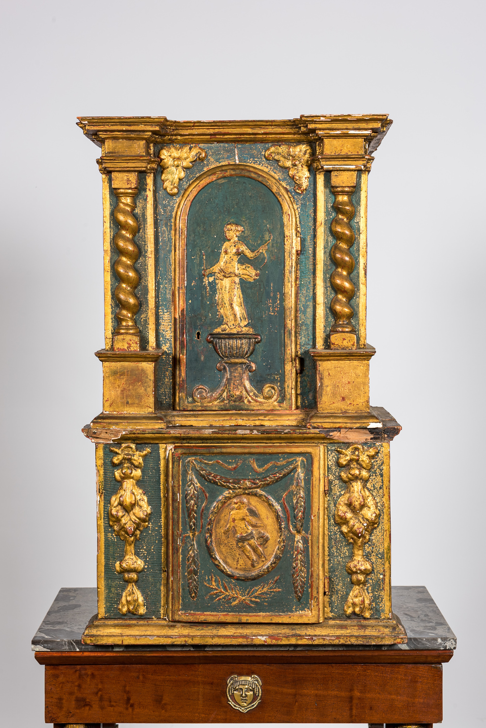 A two-part gilt and polychrome wooden tabernacle, 18th C.