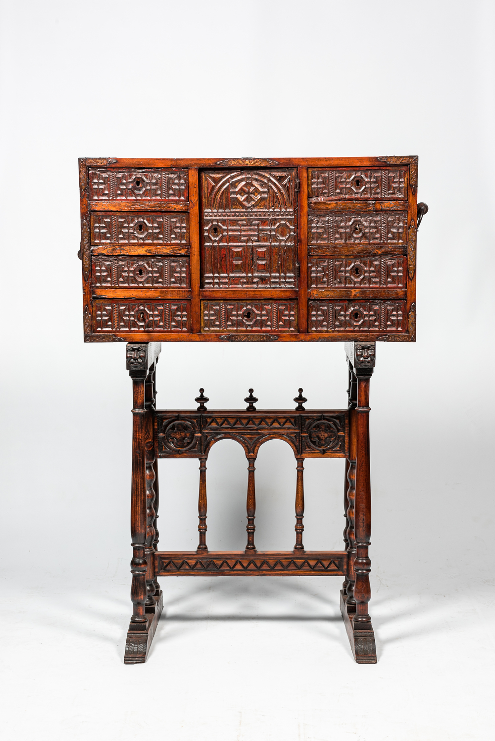 A Spanish wooden 16th-C. style 'bargue&ntilde;o' cabinet on foot, 19th C.