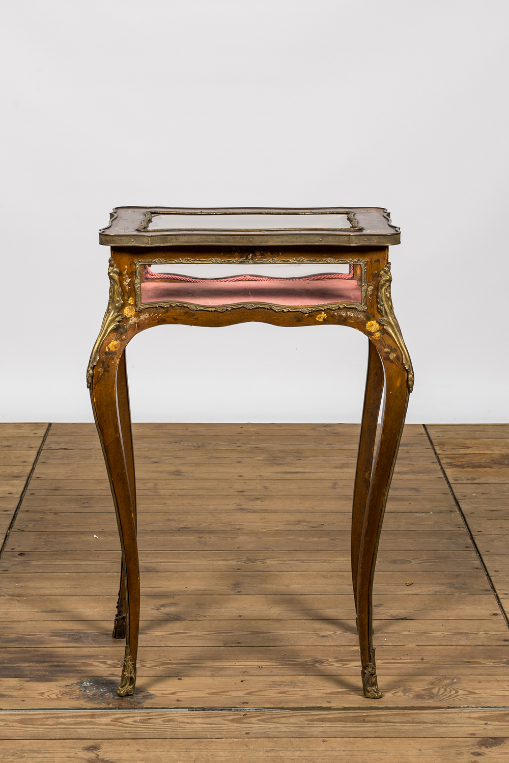 A Louis XV-style bronze mounted walnut table display case with polychrome floral design, 19th C.