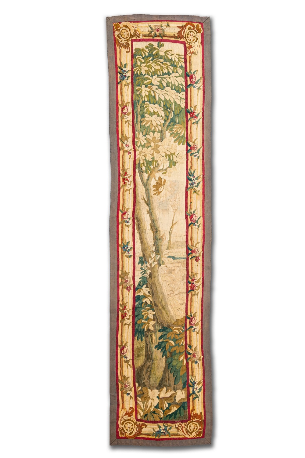 A vertical Flemish wall hanging tapestry depicting a tree, 17th C.