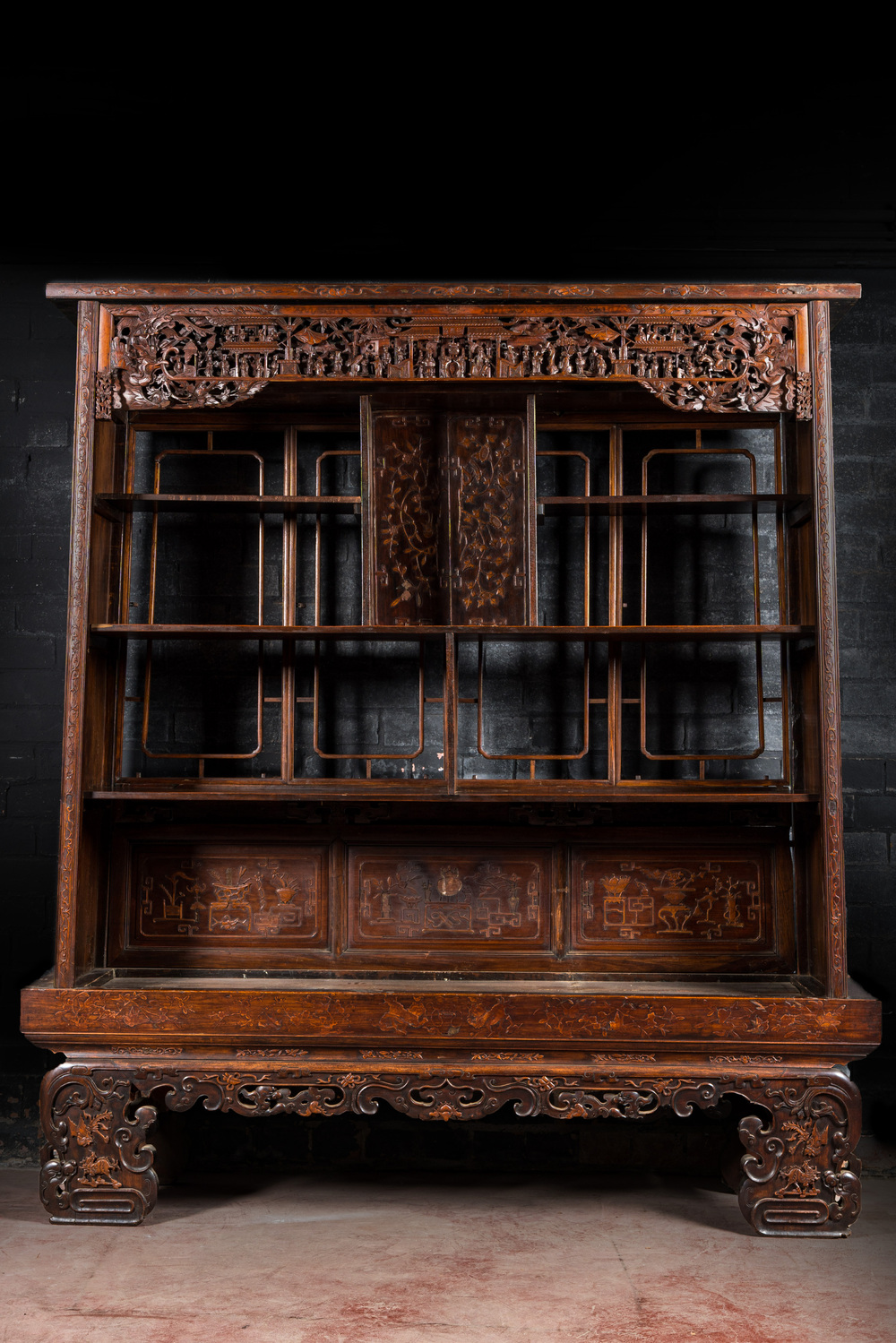 A large Chinese carved and reticulated wooden &eacute;tag&egrave;re, 19th C.