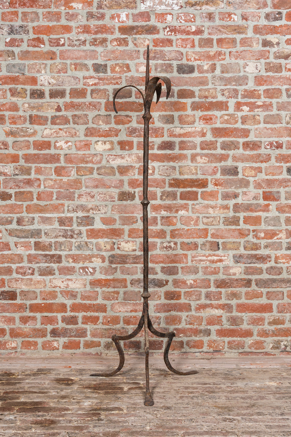 A large wrought iron candlestick, 19th C.