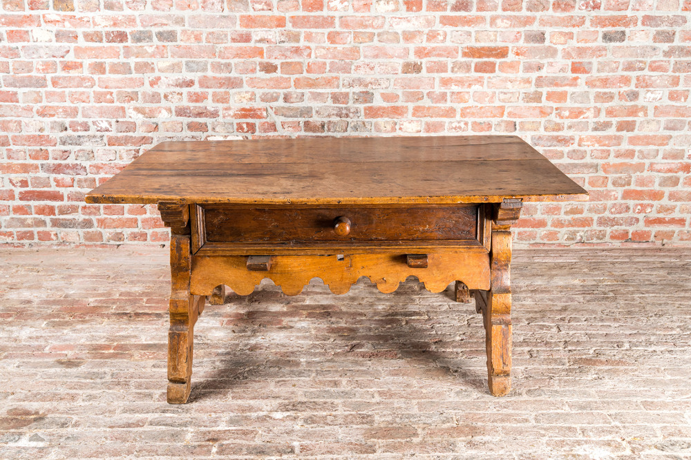 A presumably German walnut table with drawer, 18th C.