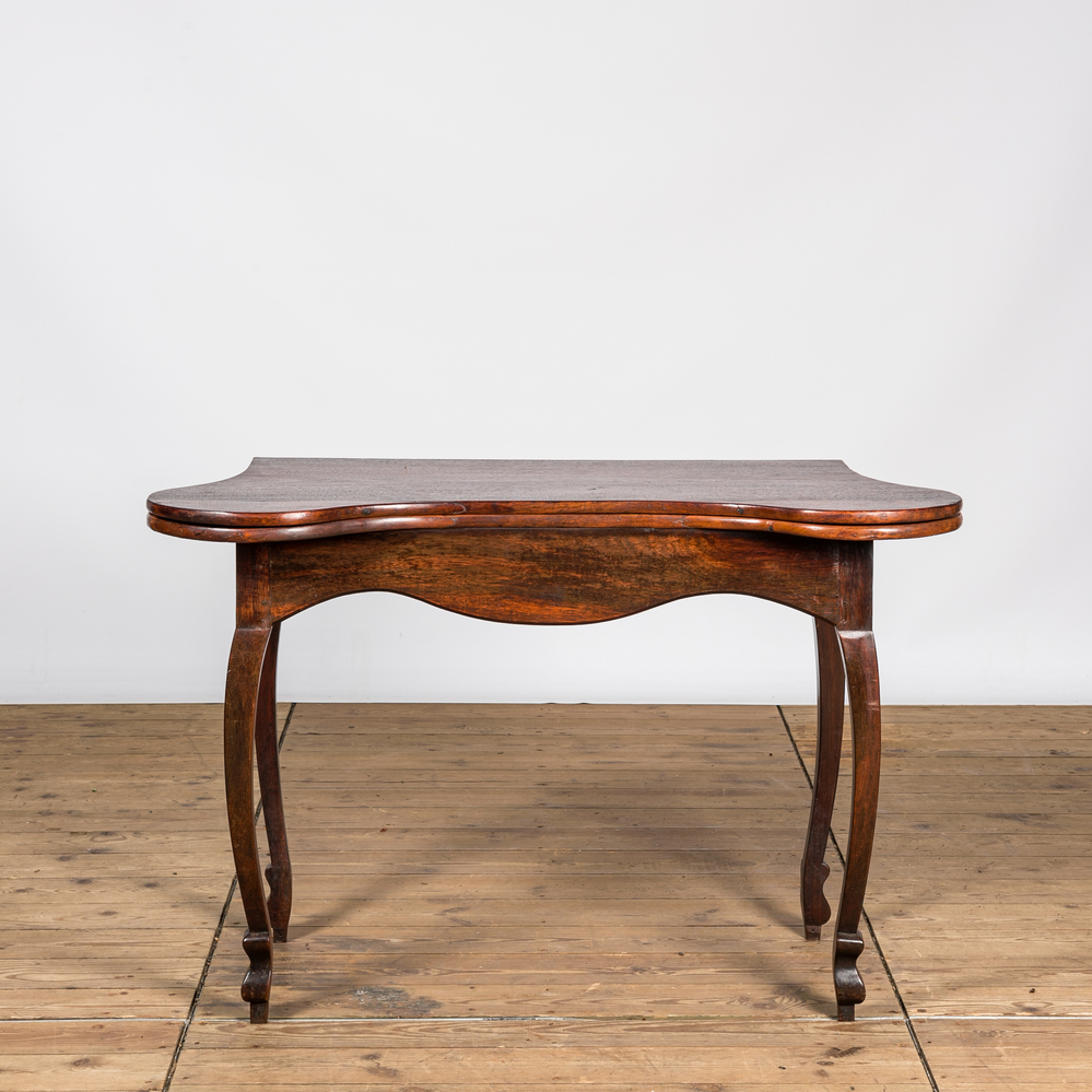 A rosewood game table, 18/19th C.