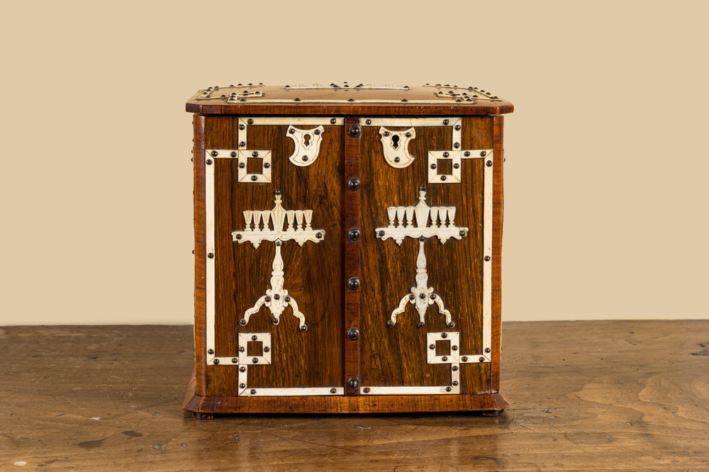 A wooden bone-decorated liqueur cellar with two carafes, two glasses and a travel bottle, 19th C.