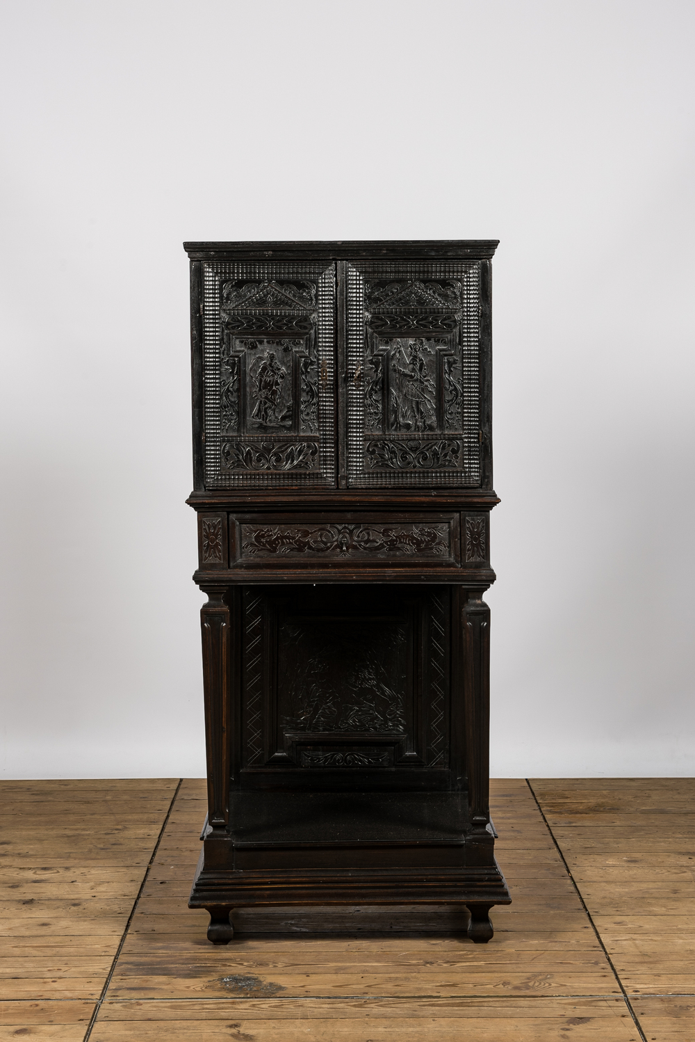 A neoclassical ebonised wooden cabinet on foot with an interior with parquetry and polychrome design, 18th C. and later