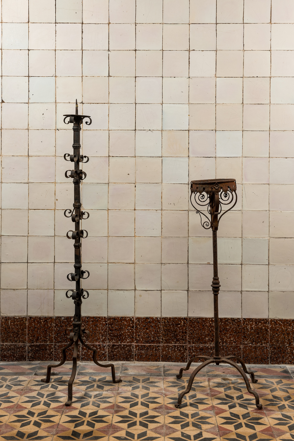 Two wrought iron candlesticks, 19th C.