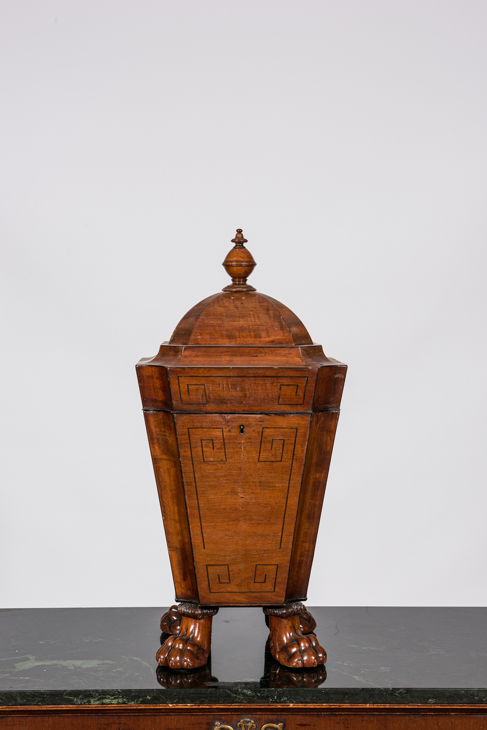 An English George III octagonal mahogany cutlery box on lion paw feet, early 19th C.
