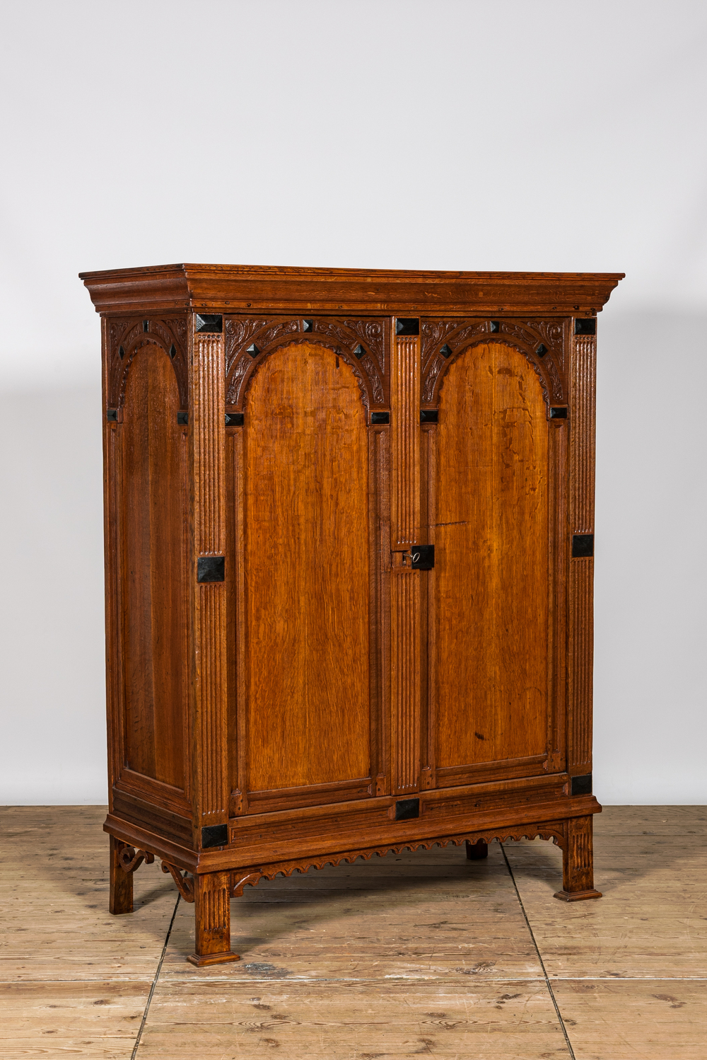 A Dutch oak two-door cupboard with ebonised elements, 17th C.