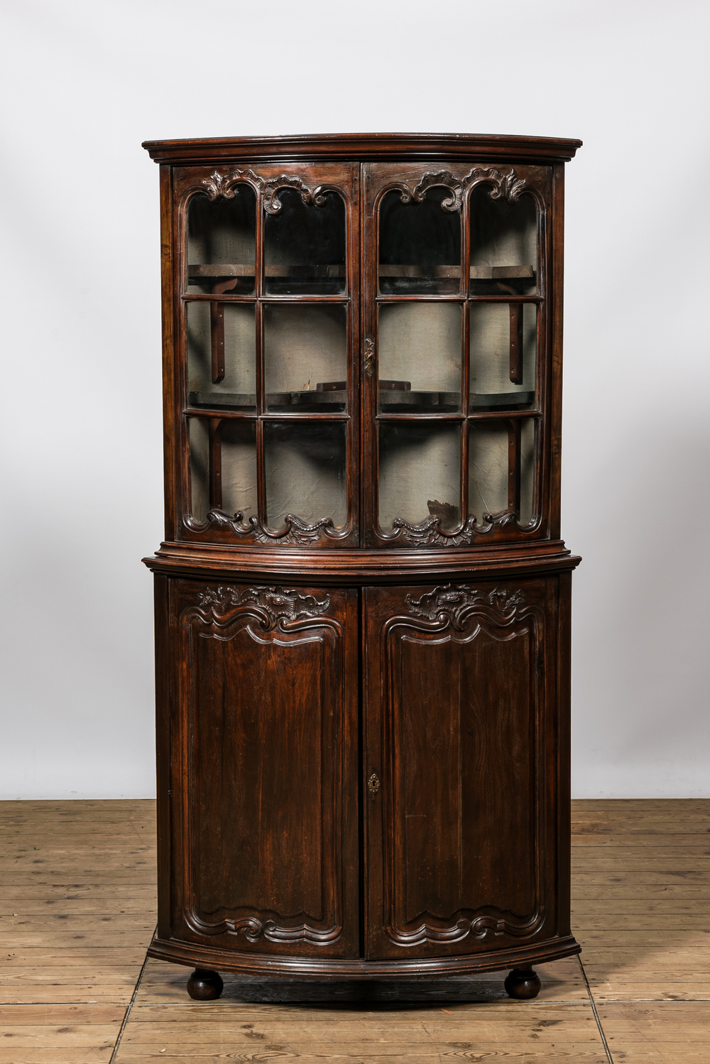 A Louis XV-style walnut corner display cabinet, 19th C.