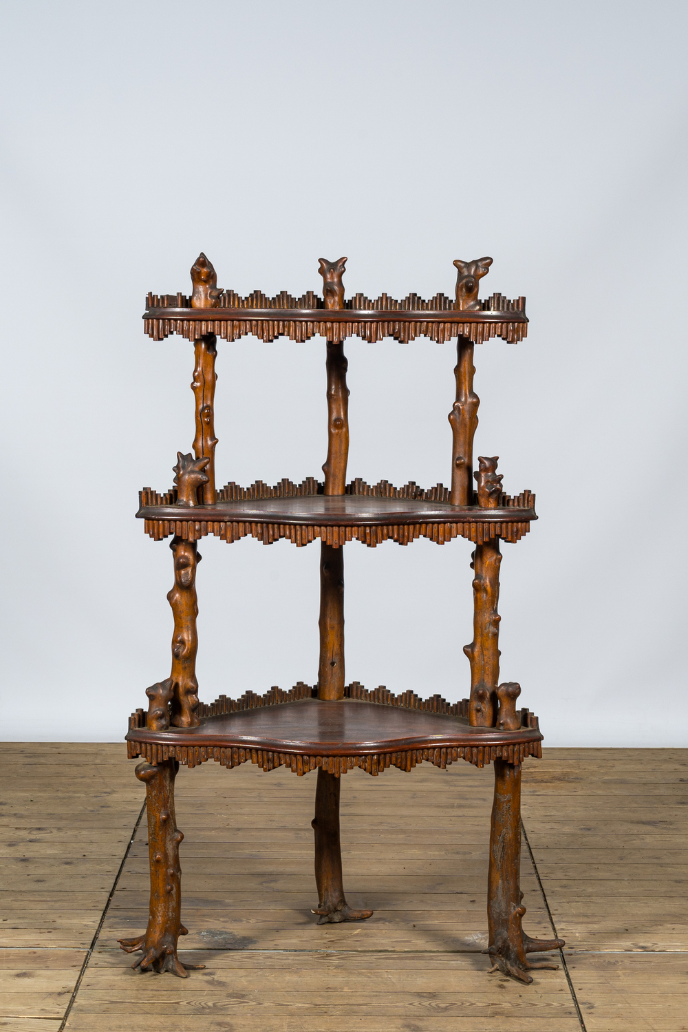 A naturalistic wooden corner rack with three shelves, 19/20th C.