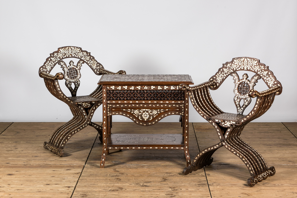 Two Indian dagobert chairs and a coffee table with mother-of-pearl inlay, 20th C.