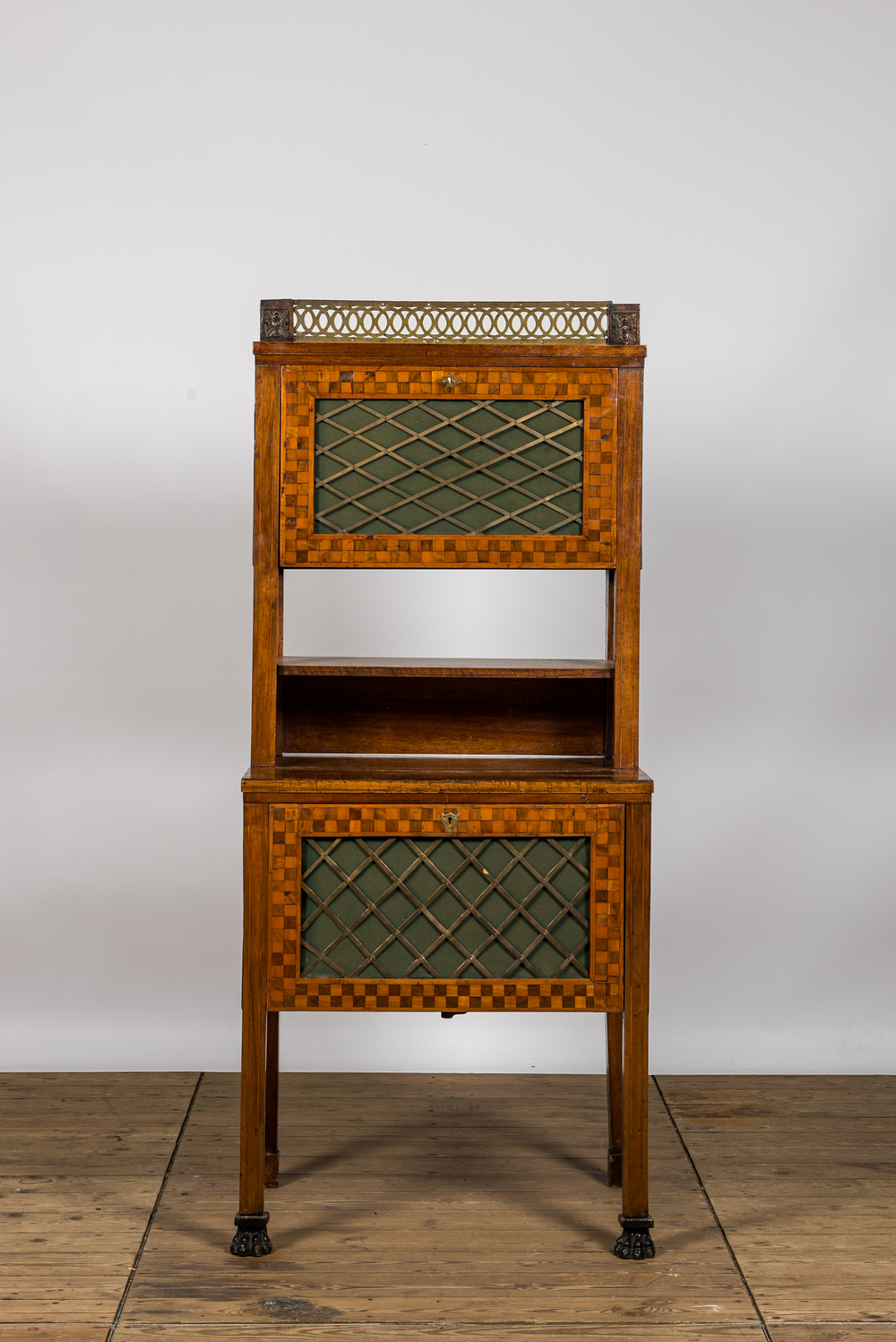 A bronze mounted mahogany cabinet with parquetry, 19th C.