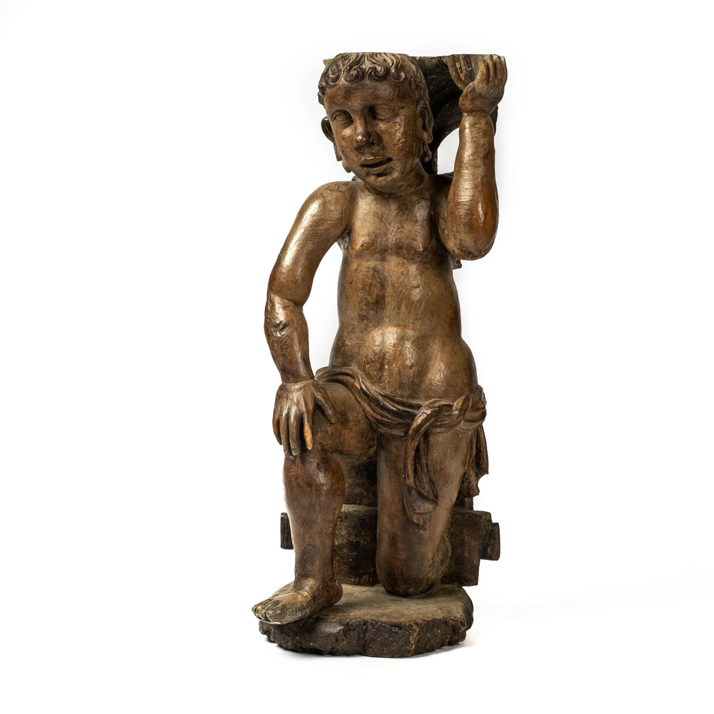 A wooden atlant in the shape of a kneeling boy, 17th C.