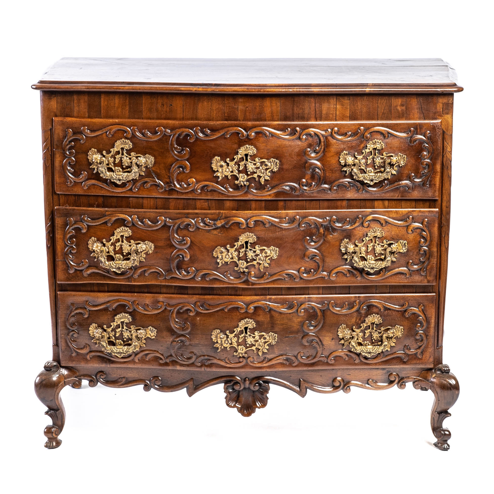 A French Louis XV-style walnut chest of drawers, 19th C.