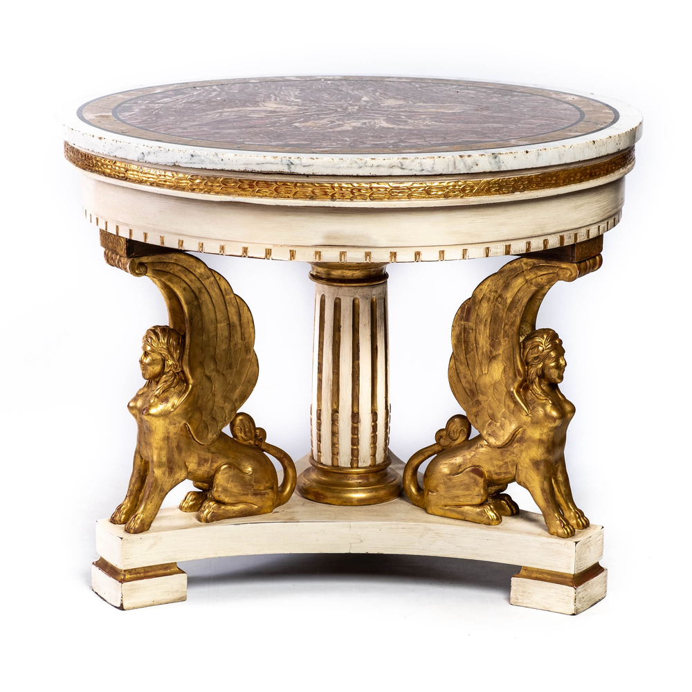 An Italian gilt and patinated wooden table with a marble top resting on three sphinxes, 19th C.