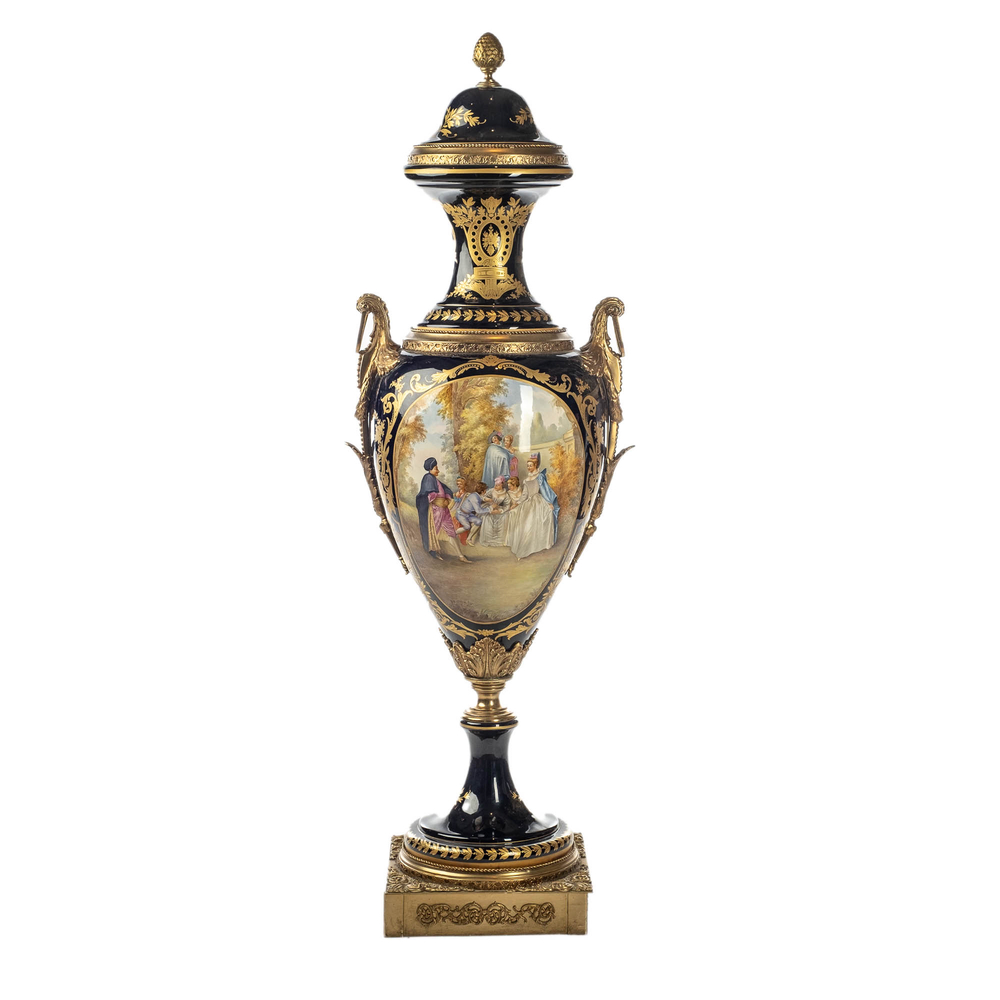A massive S&egrave;vres-style porcelain lidded vase with gilt bronze mounts, signed Nezini, early 20th C.