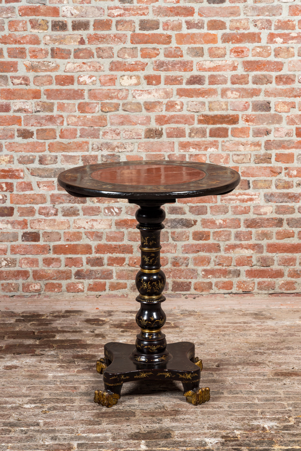 A black lacquered and gilt chinoiserie side table, 20th C.