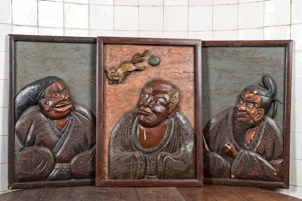 Three Japanese lacquered carved wooden panels, Meiji, 19th C.