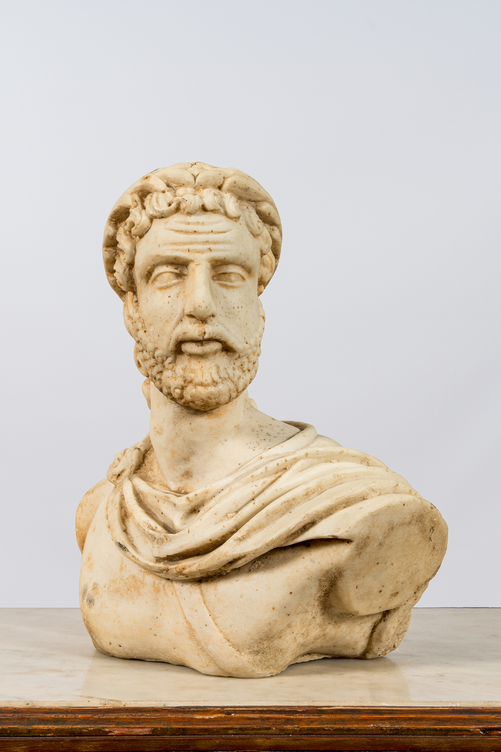 A marble bust of a Roman emperor, 20th C.