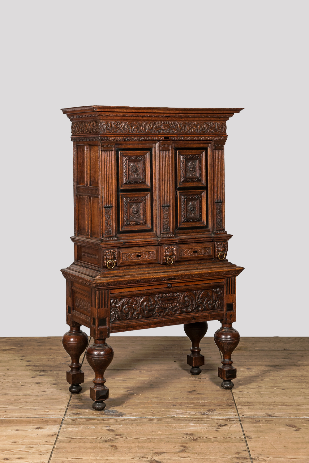 An oak and partly ebonised wooden cabinet on foot, 19th C. with older elements