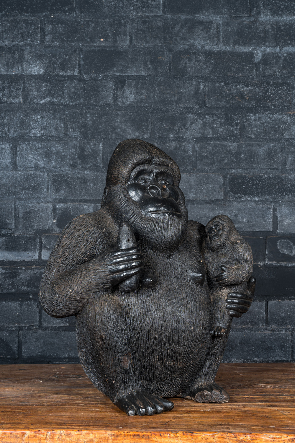 A black painted polystone gorilla, 20th C.