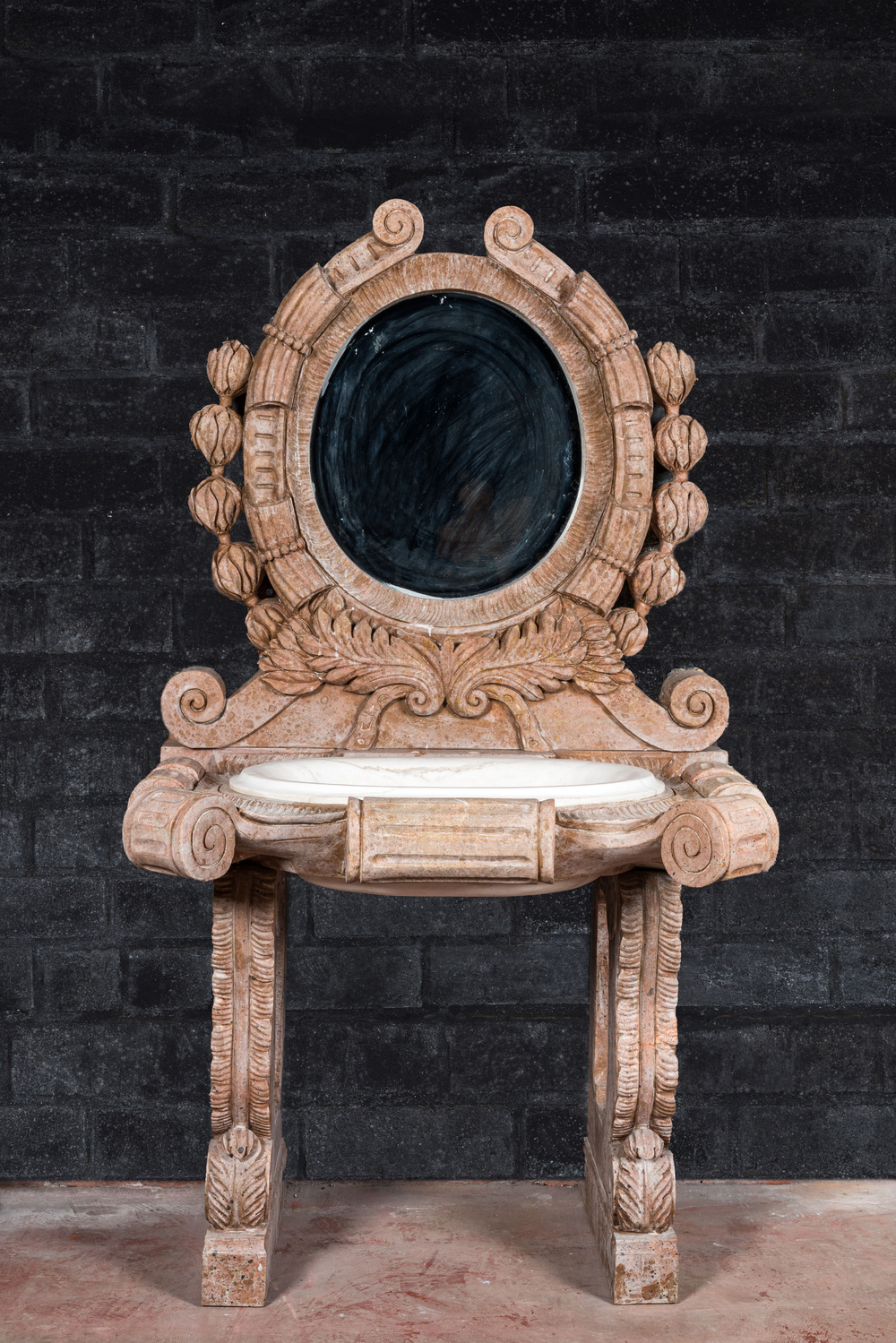 A marble washbasin with matching mirror in a historicising style, 20th C.