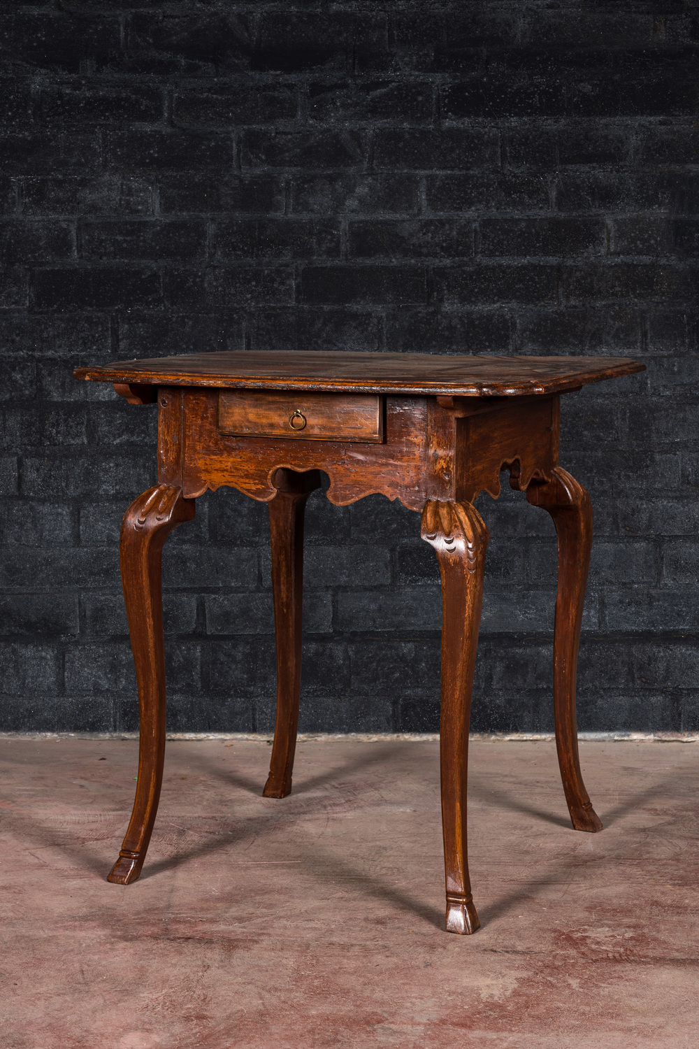 A wooden side table with a drawer, 18th C.