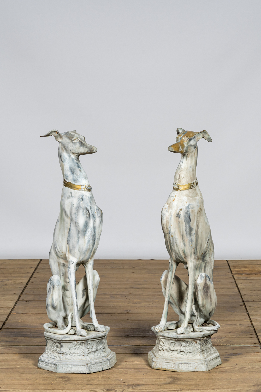 A pair of patinated metal greyhounds, 20th C.