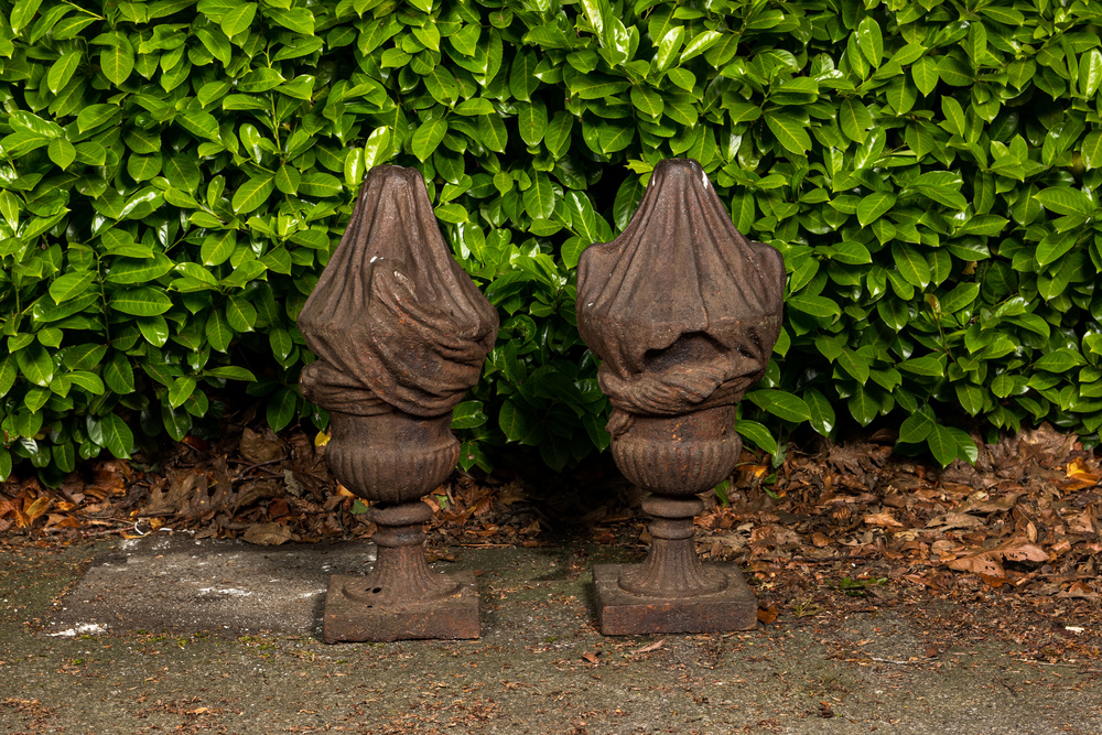 A pair of cast iron flambeaux vases, 1st half 20th C.