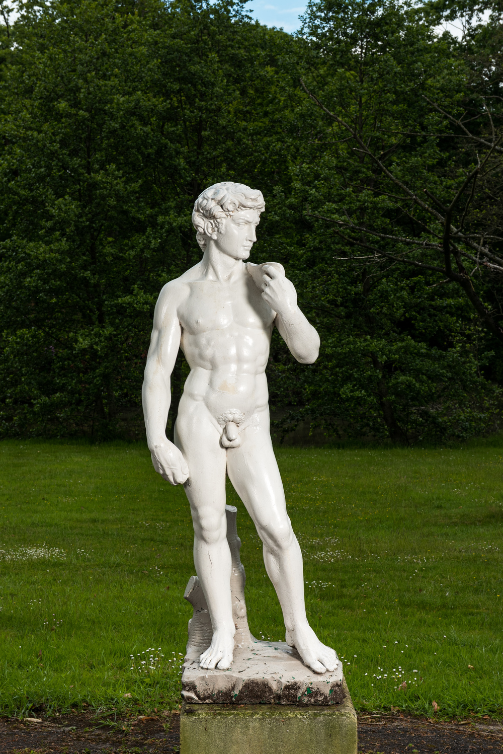 A white painted concrete sculpture of Apollo, 20th C.