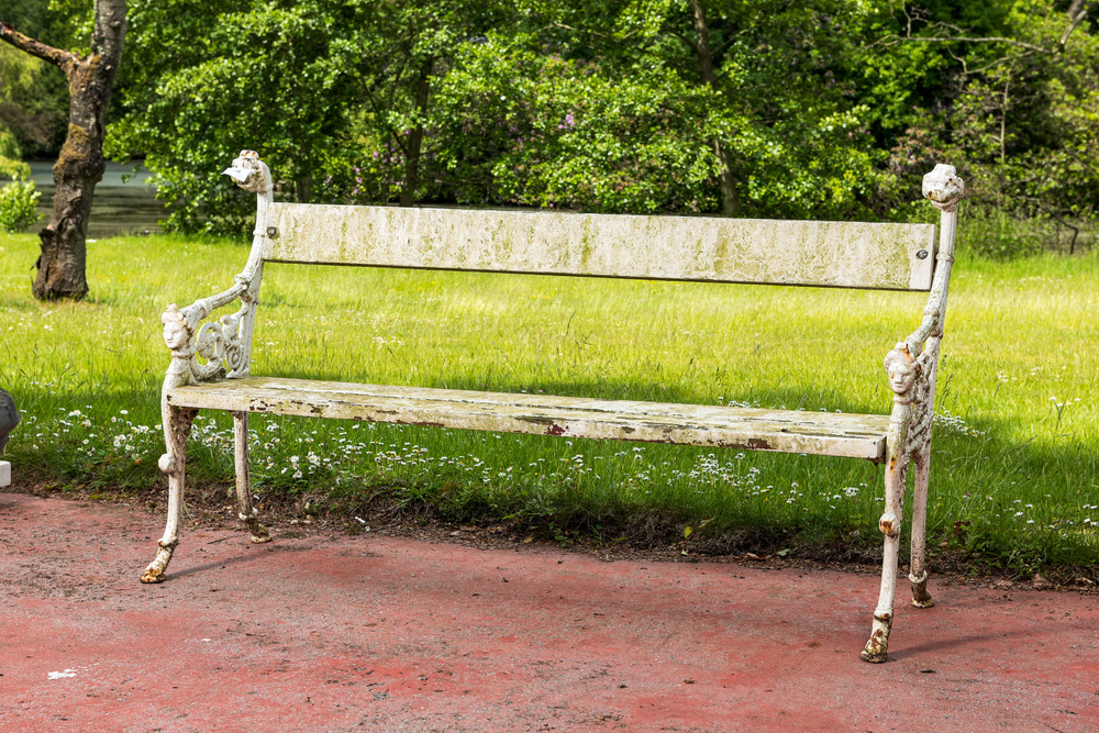 A patinated cast iron 'harlequin' garden bench, 20th C.