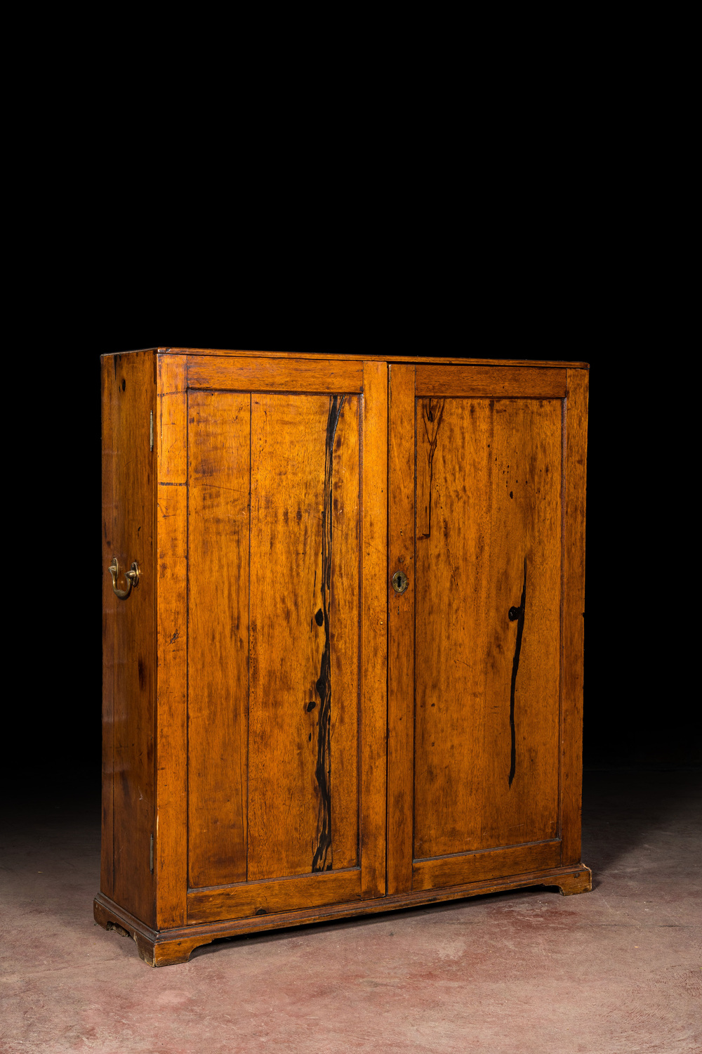 A walnut two-door cupboard, 19th C.