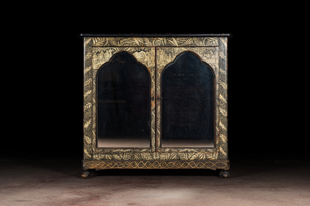 A Gothic Revival bookcase with black- and gold-painted rural scenes and foliage, 19th C.