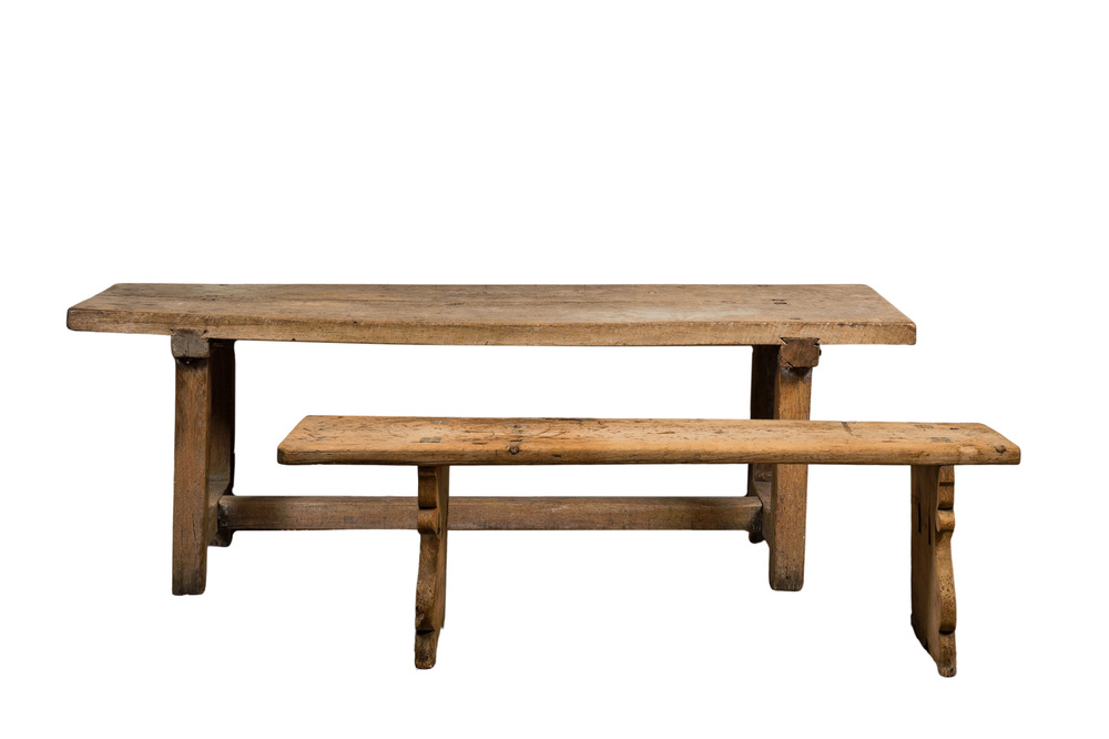 A rural wooden dining table and a bench, 19th C.