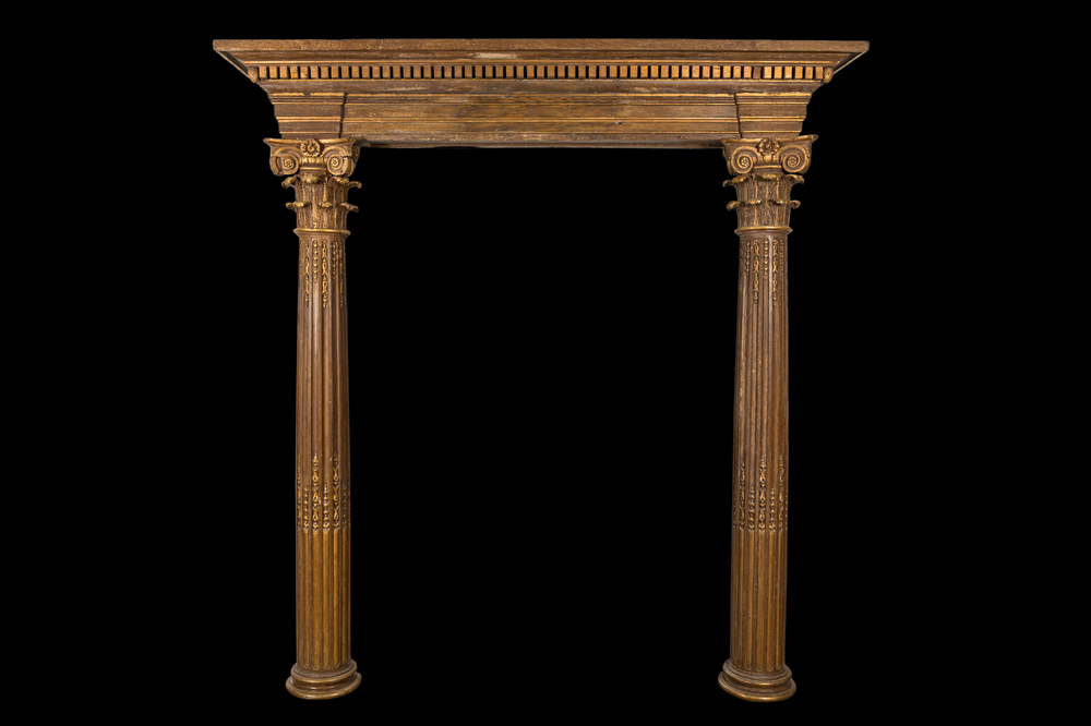 A partly gilt wooden portal with two columns with Ionic capitals, 18/19th C.