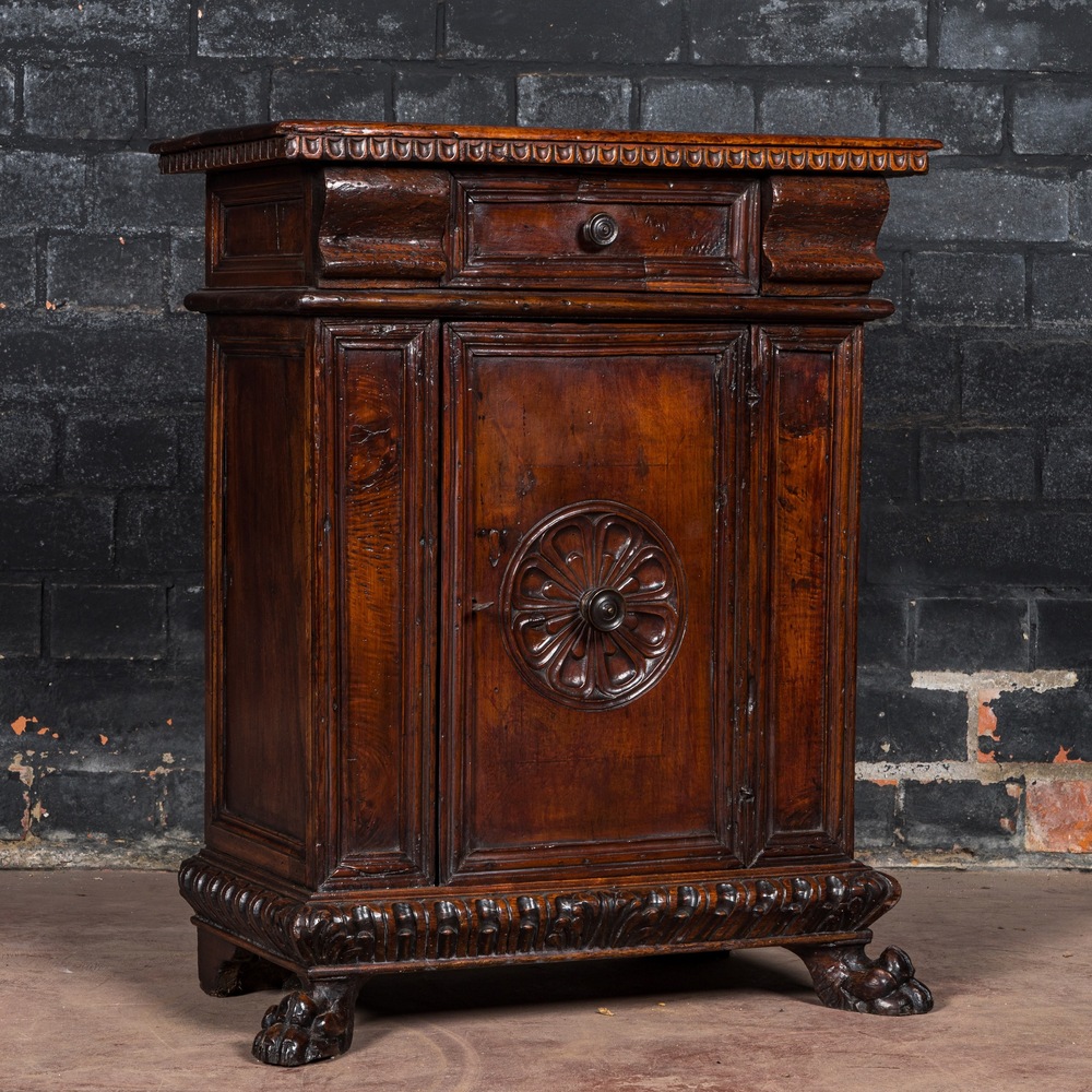 An Italian walnut one-door cupboard, 18th C.