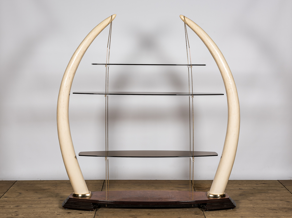 A large &eacute;tag&egrave;re with glass shelves set in faux ivory tusks, 20th C.