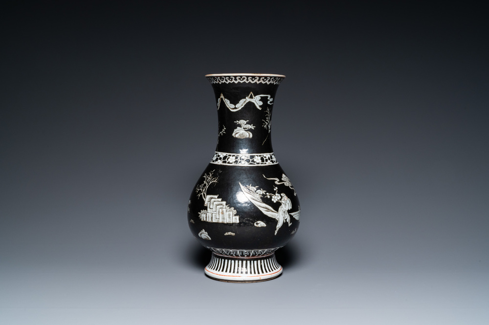 A Chinese famille noire vase with grisaille and iron-red design, 19th C.