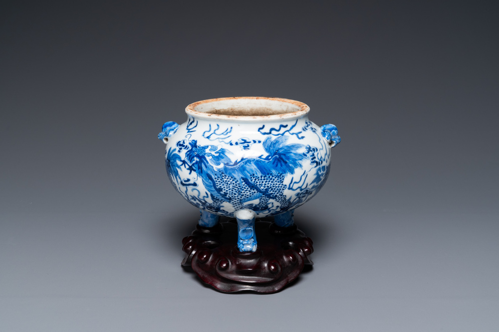 A Chinese blue and white 'mythical beasts' tripod censer, 19th C.