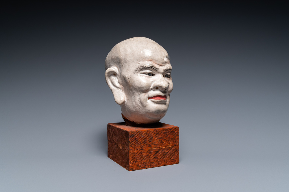 A Chinese painted stucco head of a Luohan, probably Jin or Yuan, 12/14th C.