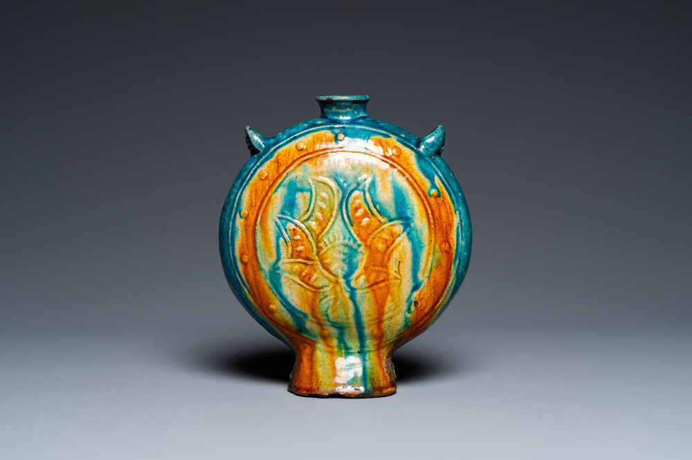 A Chinese fahua 'moonflask' with applied lotus design, Ming