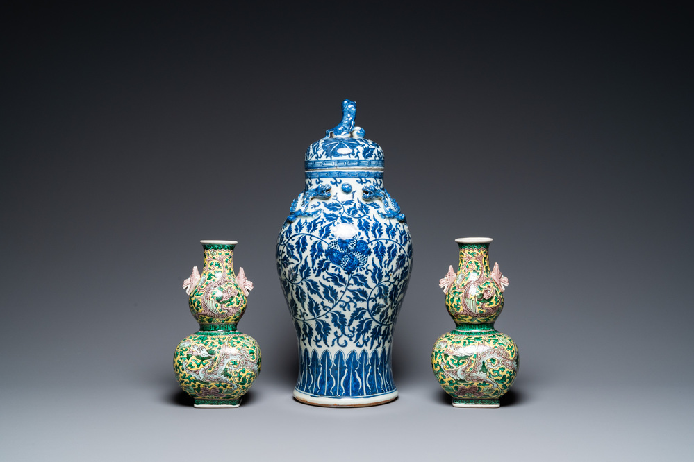 A pair of Chinese famille verte double gourd vases and a blue and white vase and cover, 19/20th C.